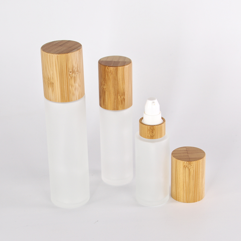 customized glass lotion bottle with sprayer pump bamboo collar