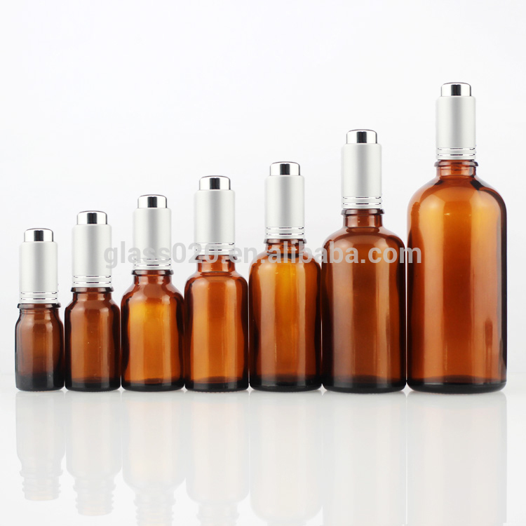 dark amber brown facial oil glass bottle 1oz with matte silver press dropper pump