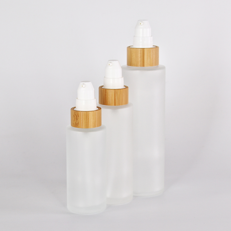 different size customized glass lotion bottle with sprayer pump bamboo collar