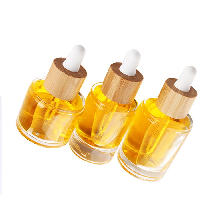 eco friendly round 15ml 30ml 50ml cosmetic clear essential oil bottle glass dropper bottle with dropper bamboo lid