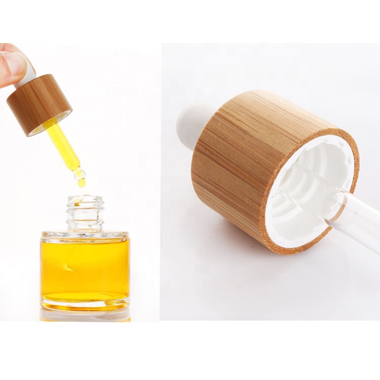 eco friendly round 15ml 30ml 50ml cosmetic clear essential oil bottle glass dropper bottle with dropper bamboo lid