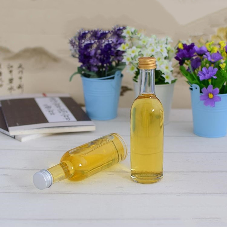 empty 50ml 100ml mini round glass liquor bottle with screw cap