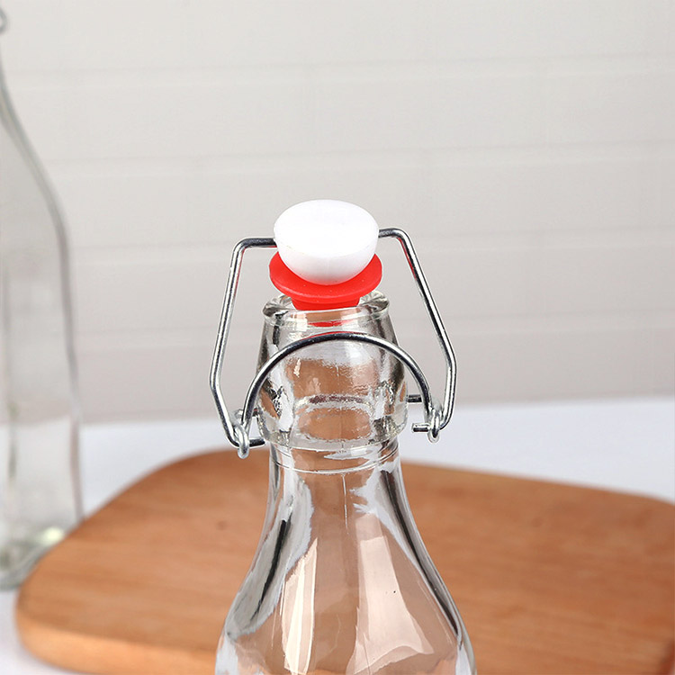 empty clear glass oil bottle with airtight swing top lid 750ml