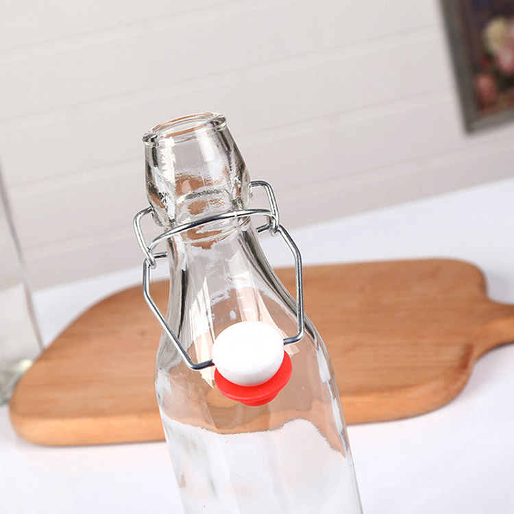 empty clear glass oil bottle with airtight swing top lid 750ml
