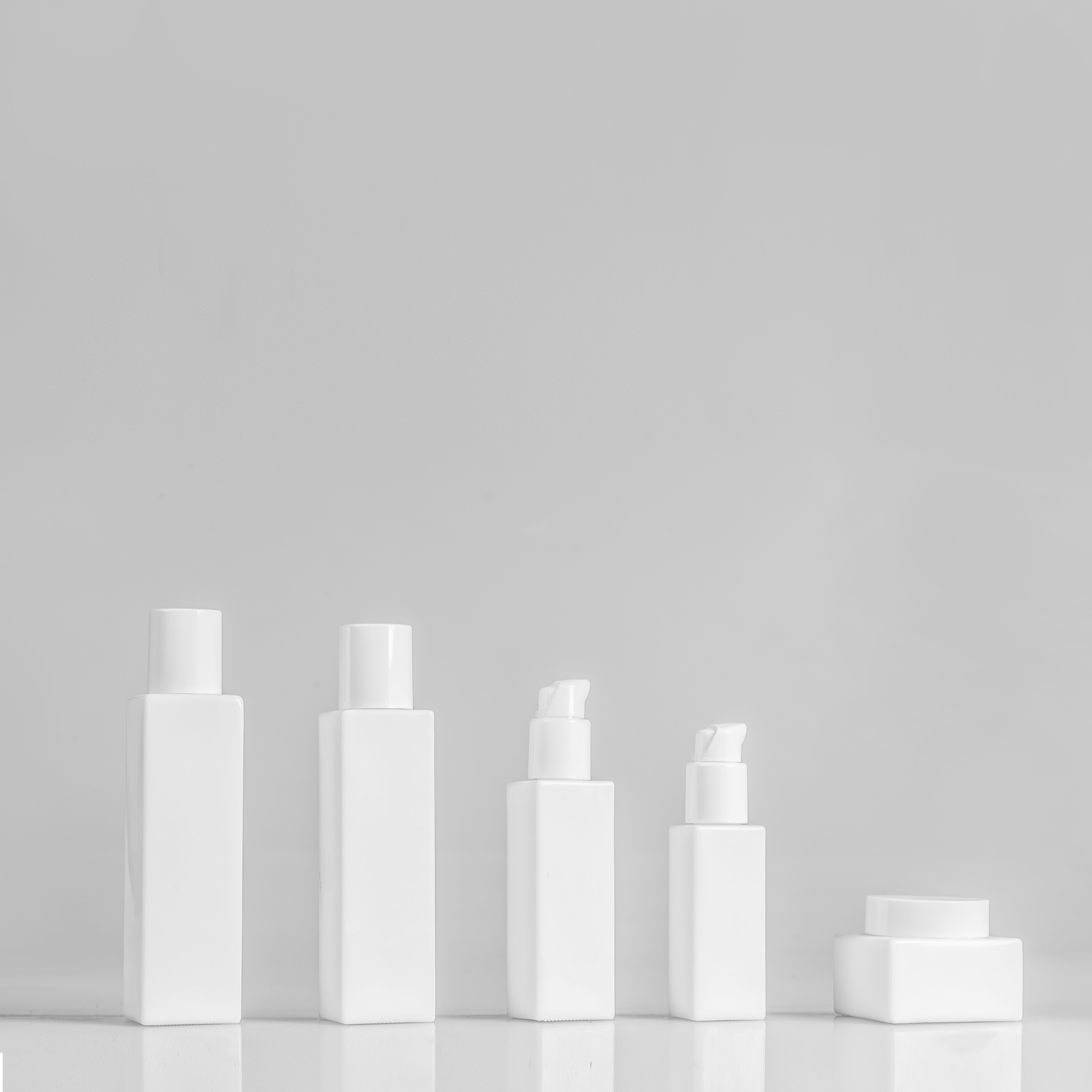 fancy unique design cosmetic empty glass bottle jar with printing series for natural cream and lotion
