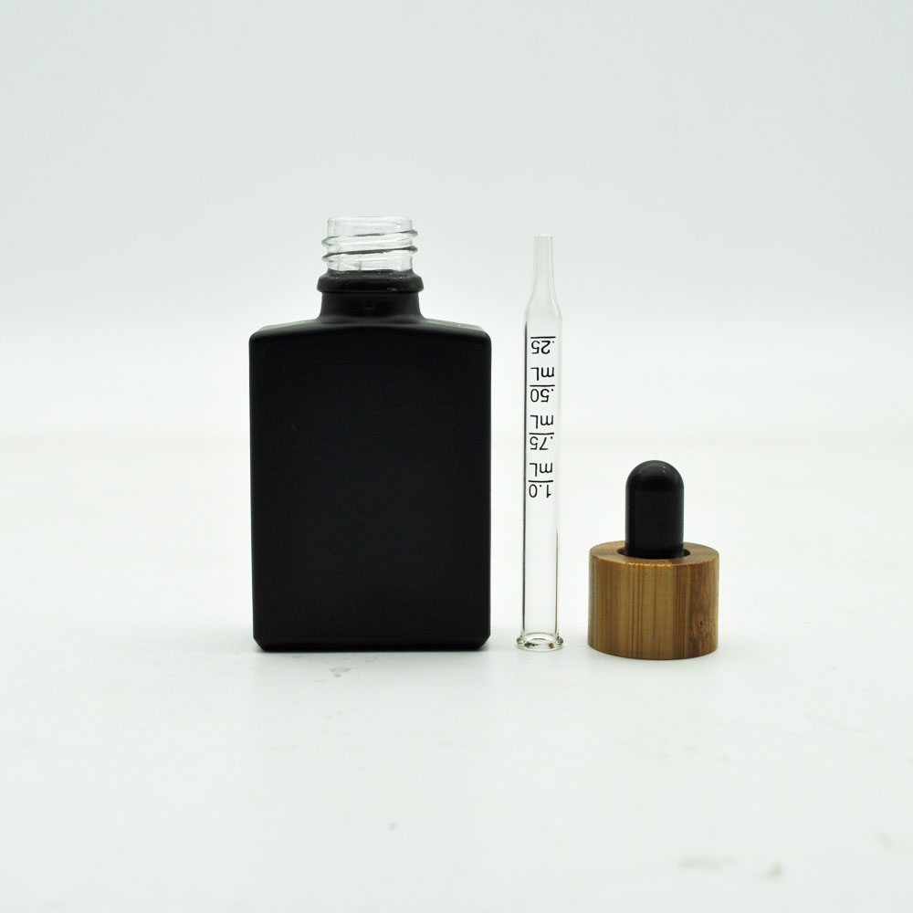free sample 30ml empty matte black frosted clear round essential oil glass bottle with bamboo wood lid cap