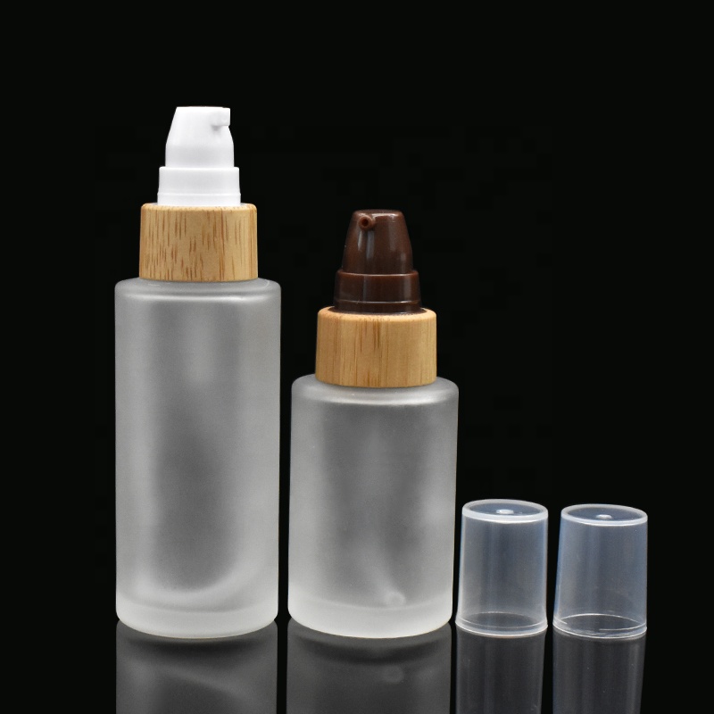 frosted glass bottles 30ml 50ml flat shoulder glass bottles 100ml 120ml with bamboo pump cap for lotion shampoo
