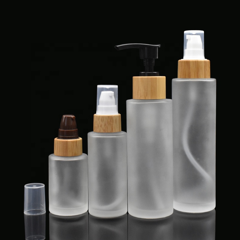 frosted glass bottles 30ml 50ml flat shoulder glass bottles 100ml 120ml with bamboo pump cap for lotion shampoo