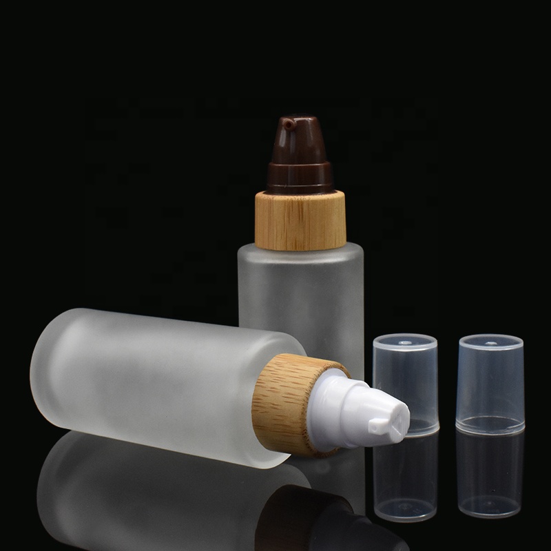 frosted glass bottles 30ml 50ml flat shoulder glass bottles 100ml 120ml with bamboo pump cap for lotion shampoo
