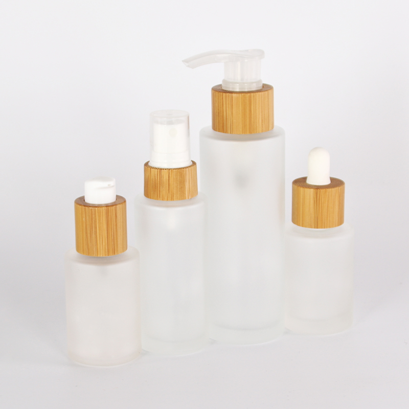 frosted glass bottles 30ml 50ml flat shoulder glass bottles 100ml 120ml with bamboo pump cap for lotion shampoo