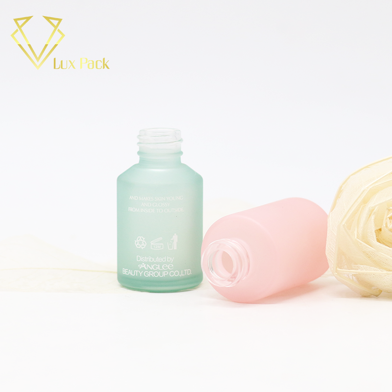 frosted green and pink cosmetic glass bottle fancy packaging
