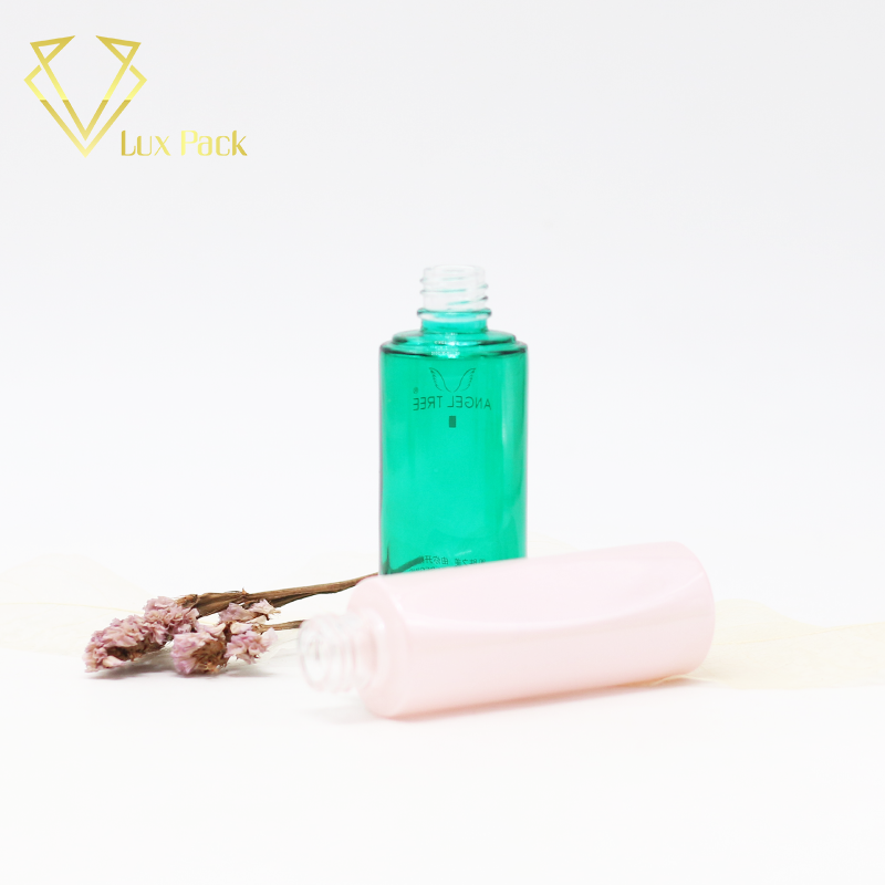 frosted green and pink cosmetic glass bottle fancy packaging