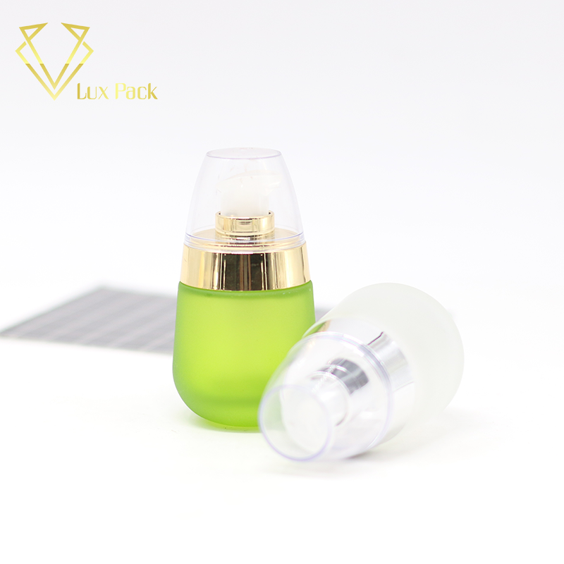frosted green and pink cosmetic glass bottle fancy packaging