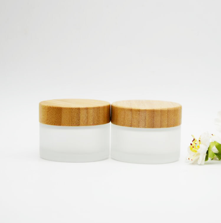 glass cosmetic cream jar with bamboo lid