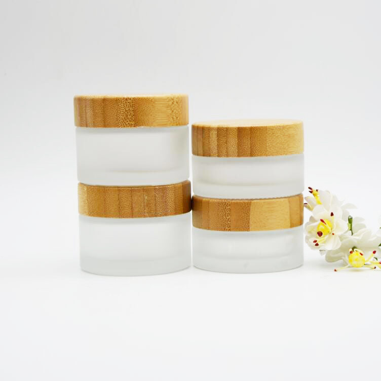 glass cosmetic cream jar with bamboo lid