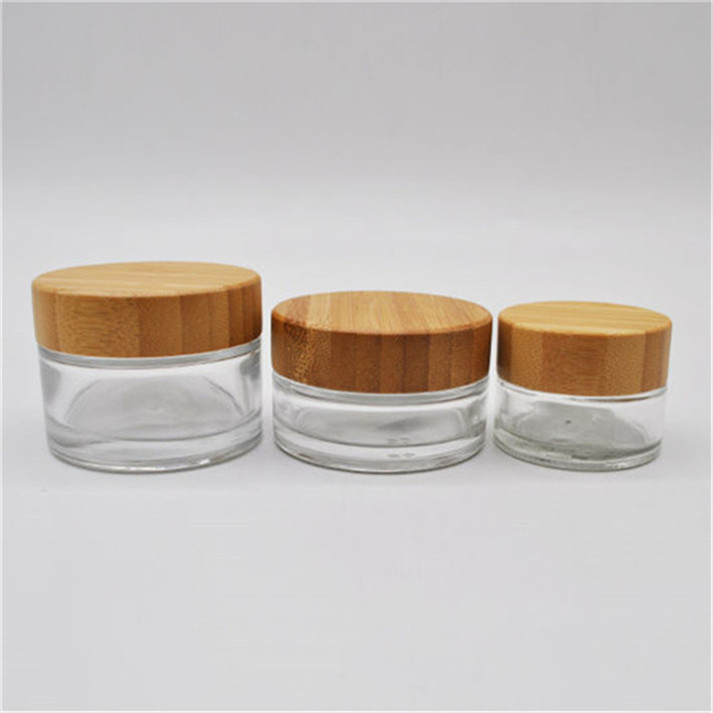 glass cosmetic jar and bottles with bamboo lid packaging