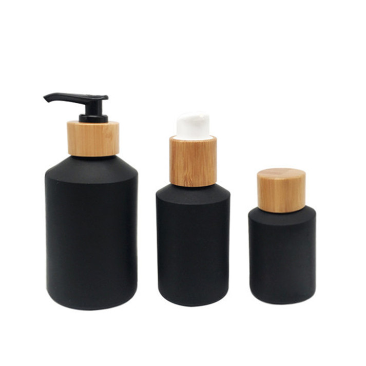 glass cosmetic jar and bottles with bamboo lid packaging
