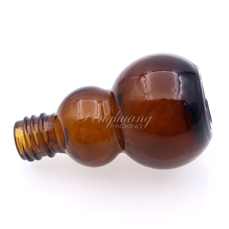 gourd shape glass essential oil bottles hot selling/pretty shape cosmetic packing fo oil