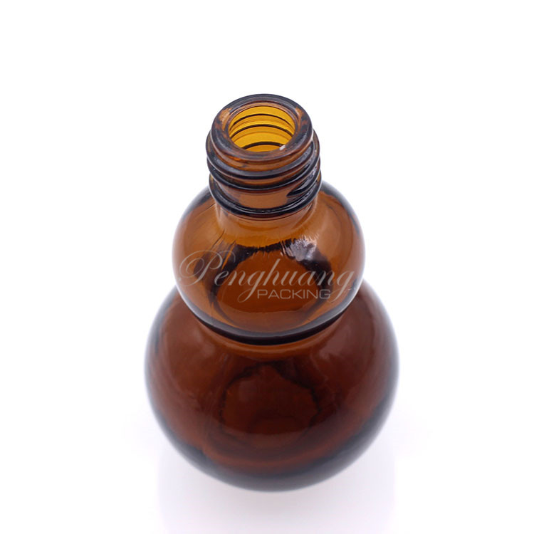 gourd shape glass essential oil bottles hot selling/pretty shape cosmetic packing fo oil