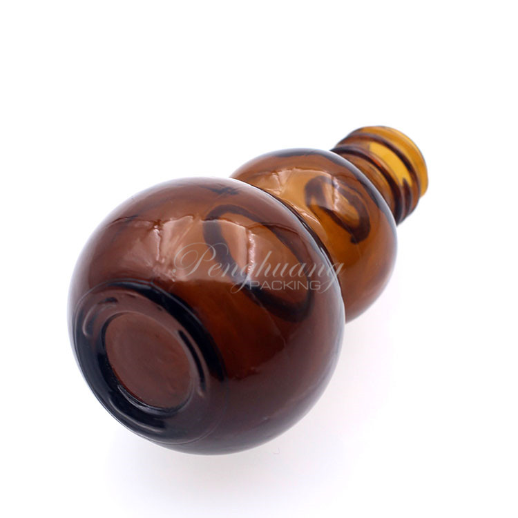 gourd shape glass essential oil bottles hot selling/pretty shape cosmetic packing fo oil