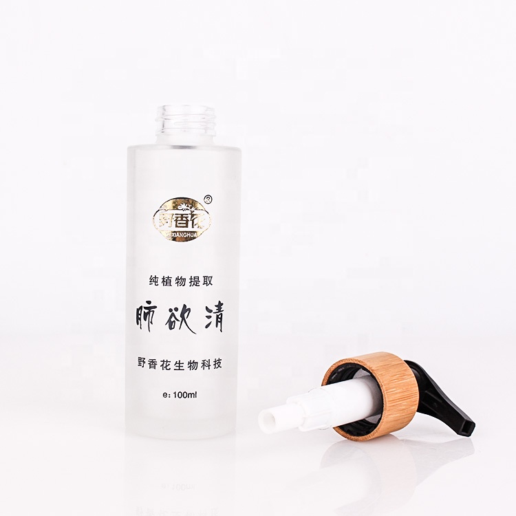 high end 110ml frosted cosmetic packing glass lotion bottle with bamboo pump
