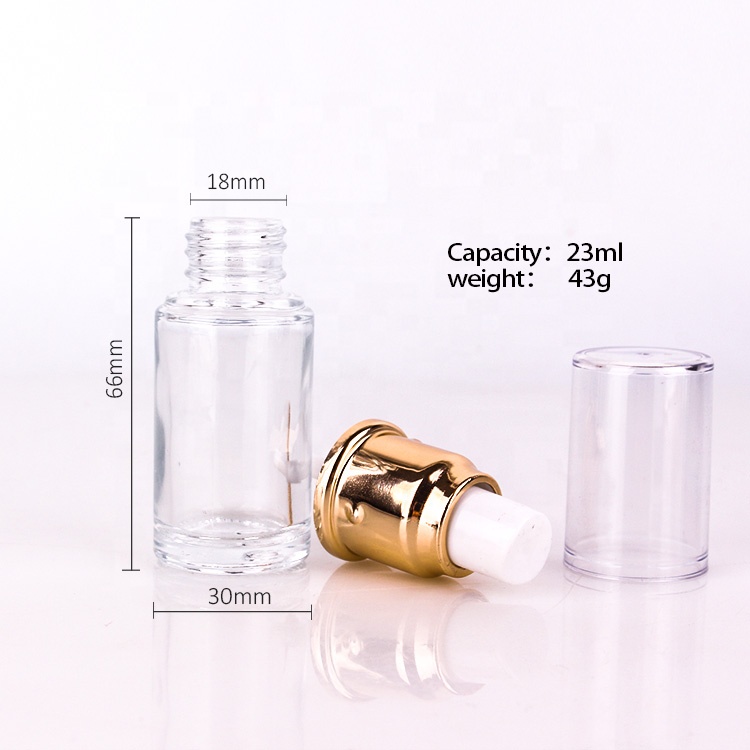 high end cosmetic packing 1oz clear glass lotion bottle with gold metal lotion pump