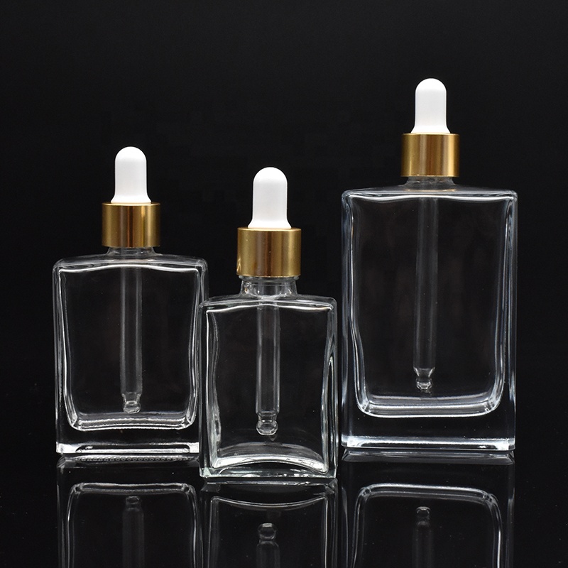 high-end square clear glass dropper bottles 30ml 50ml 100ml rectangle glass dropper bottles with gold cap for essential oil
