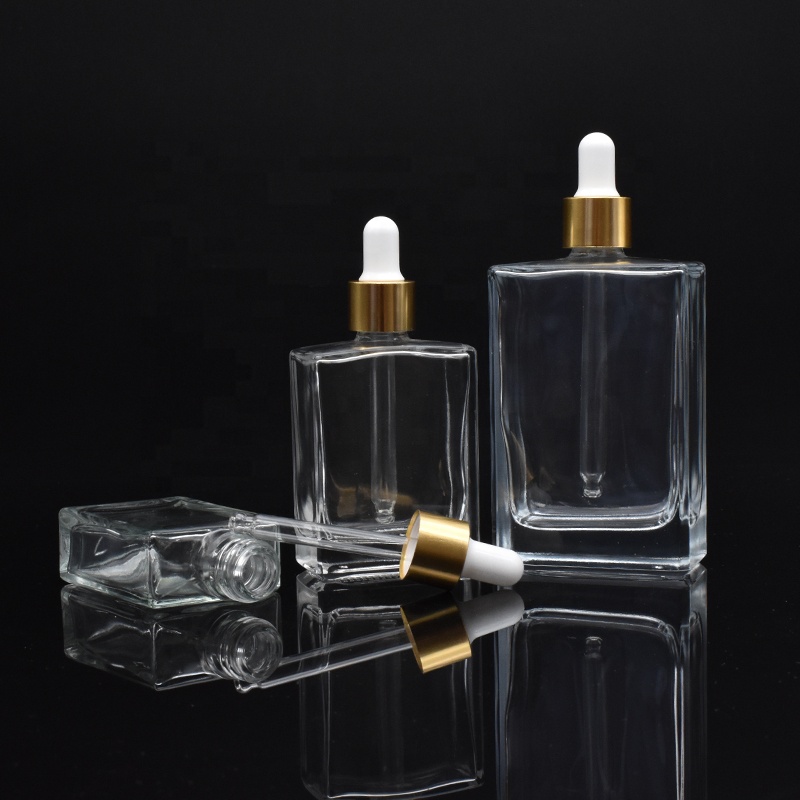 high-end square clear glass dropper bottles 30ml 50ml 100ml rectangle glass dropper bottles with gold cap for essential oil