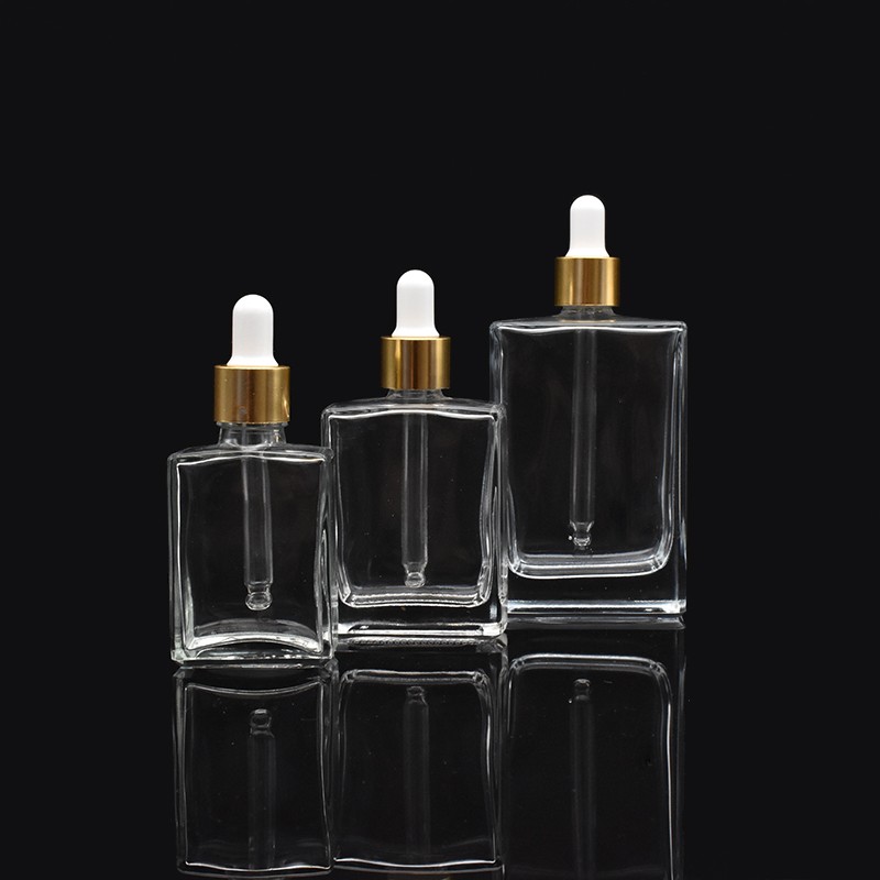 high-end square clear glass dropper bottles 30ml 50ml 100ml rectangle glass dropper bottles with gold cap for essential oil