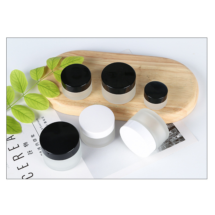 high quality 30 ml 1oz clear frosted cosmetic packaging glass jar with white black plastic cap for skin care cream