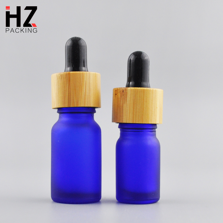 high quality 30ml 50ml round black amber round frosted cosmetic essential oil bottle with bamboo lid