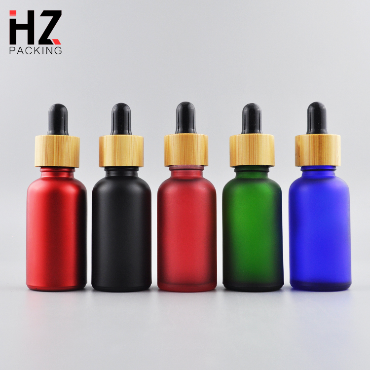 high quality 30ml 50ml round black amber round frosted cosmetic essential oil bottle with bamboo lid