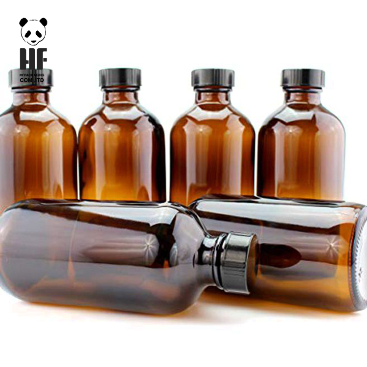 high quality 4oz boston round amber glass bottle container with black plastic cap