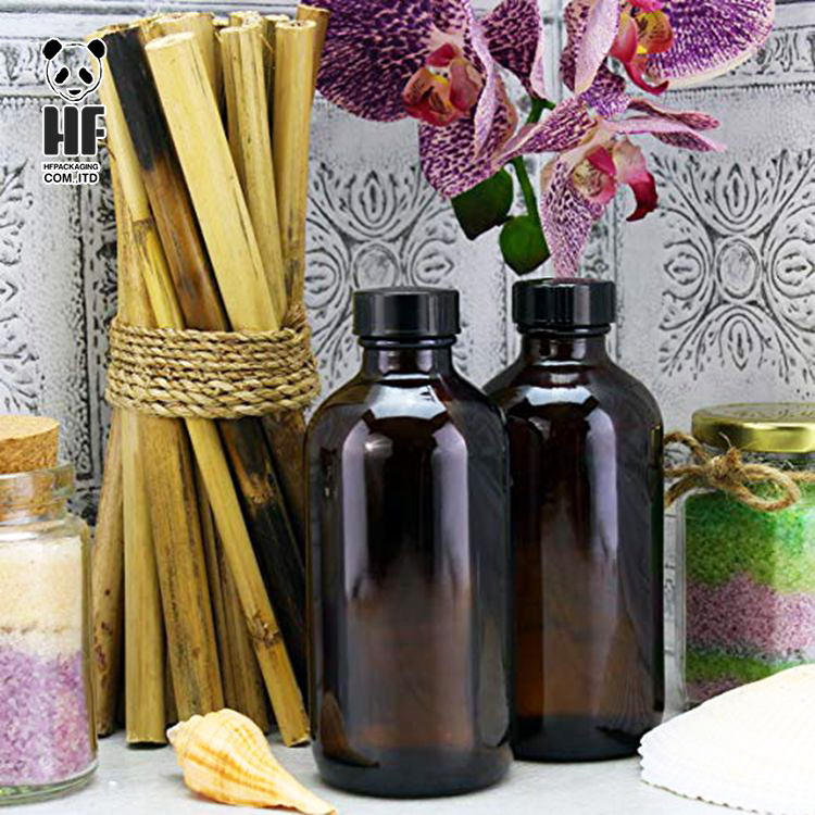 high quality 4oz boston round amber glass bottle container with black plastic cap