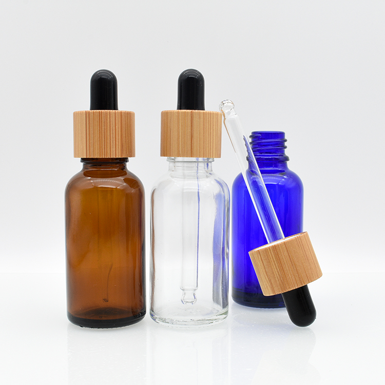 high quality cosmetic essential oil 5ml 10ml 15ml 20ml 30ml 50ml 100ml amber clear glass tincture bottle with bamboo dropper