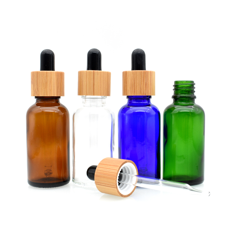 high quality cosmetic essential oil 5ml 10ml 15ml 20ml 30ml 50ml 100ml amber clear glass tincture bottle with bamboo dropper