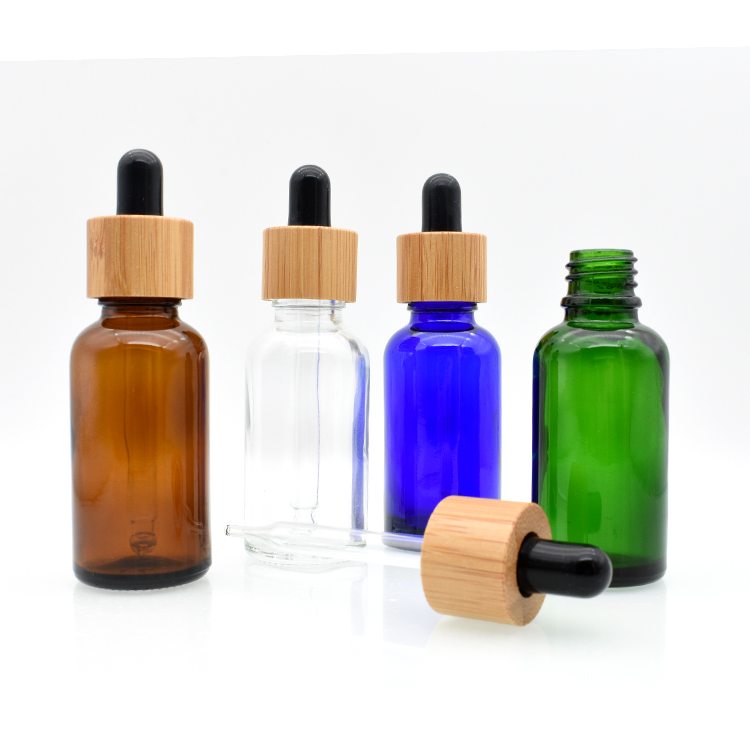 high quality cosmetic essential oil 5ml 10ml 15ml 20ml 30ml 50ml 100ml amber clear glass tincture bottle with bamboo dropper