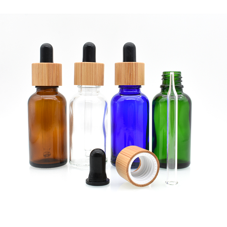 high quality cosmetic essential oil 5ml 10ml 15ml 20ml 30ml 50ml 100ml amber clear glass tincture bottle with bamboo dropper