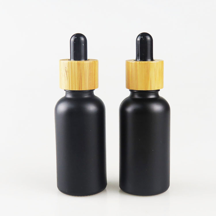 high quality glass material essential oil use 30ml frosted black glass dropper bottle bamboo cap