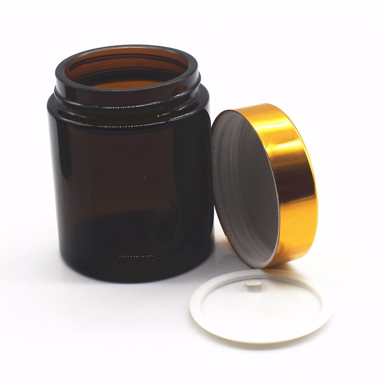 hot sale 10g 30g 1oz cosmetic packaging amber glass jar with gold/silver/black lid