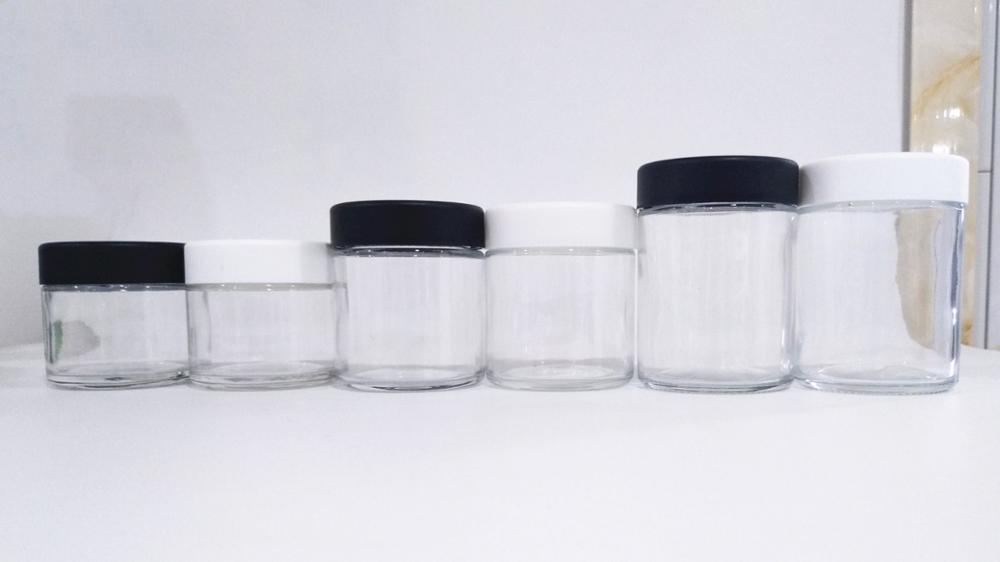 hot sale 2oz air tight glass jar child resistant lid 3oz child proof cap glass packaging 4oz qingdao xinte glass jars cosmetic