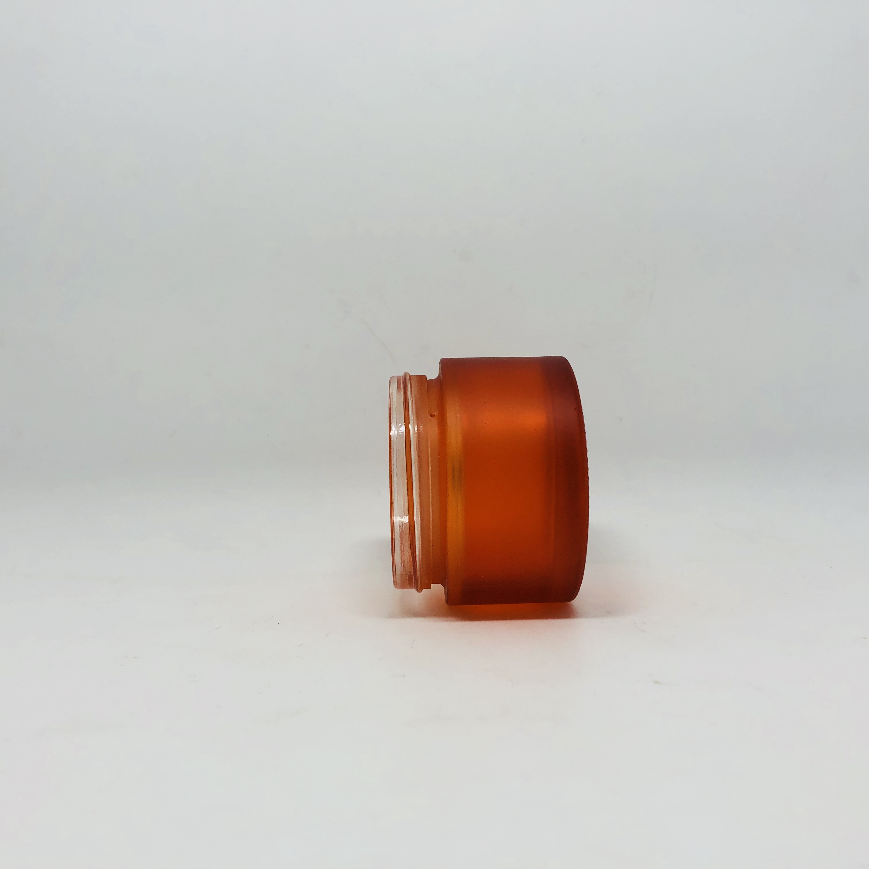 hot sale cosmetic orange forested glass jar with black plastic lid custom brand and logo