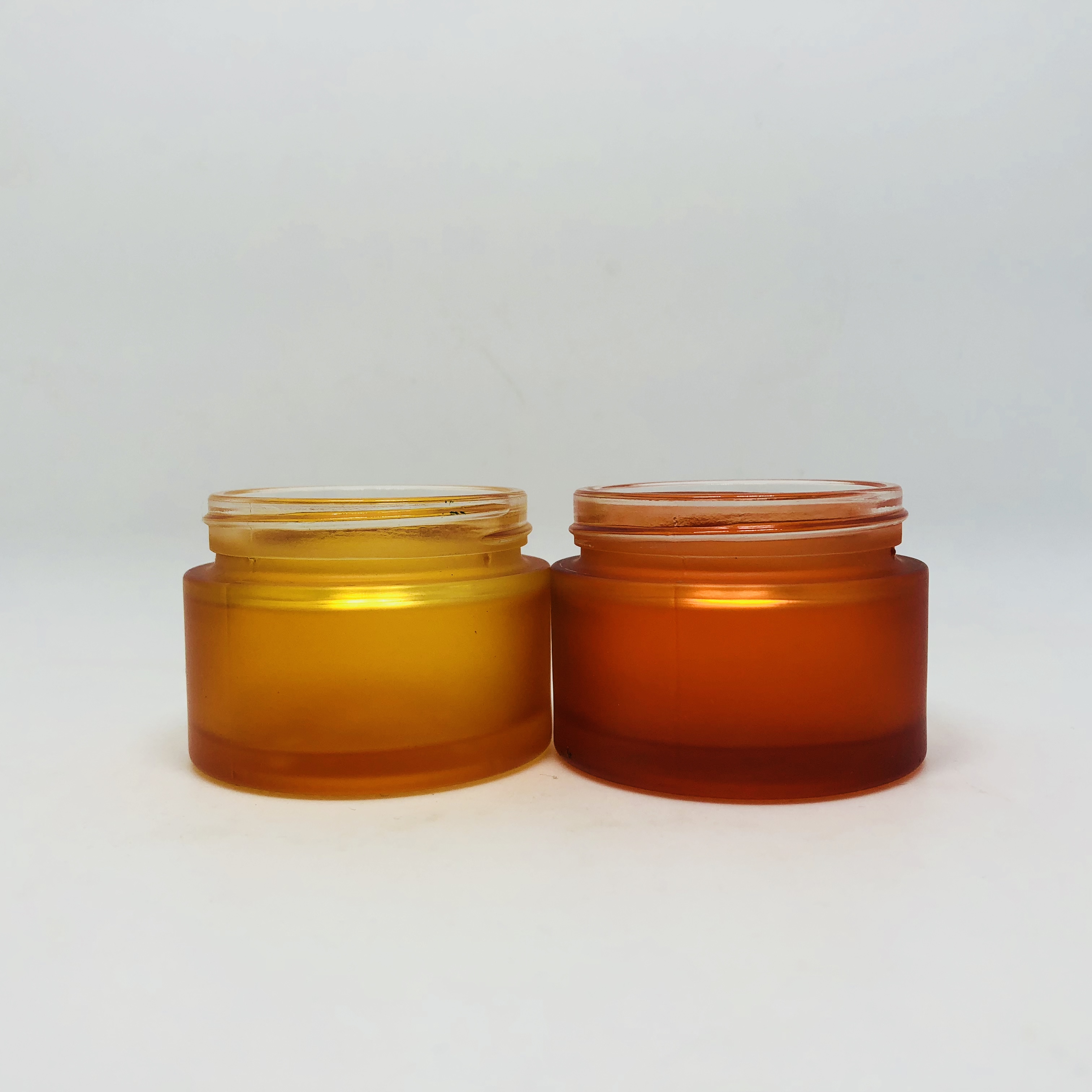 hot sale cosmetic orange forested glass jar with black plastic lid custom brand and logo