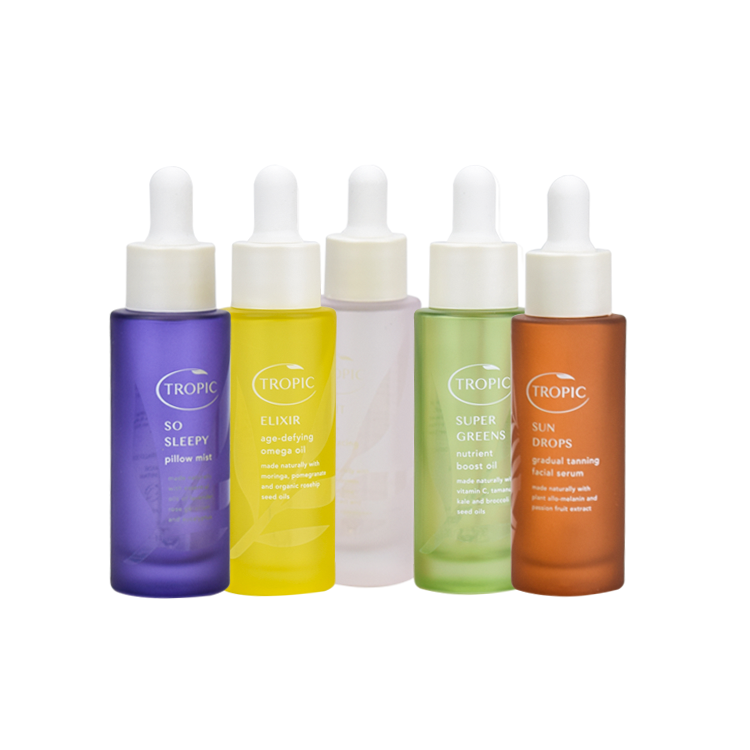 hot sale cosmetic packaging fancy flat shoulder 30ml round light pink cosmetic bottle packaging with plastic dropper