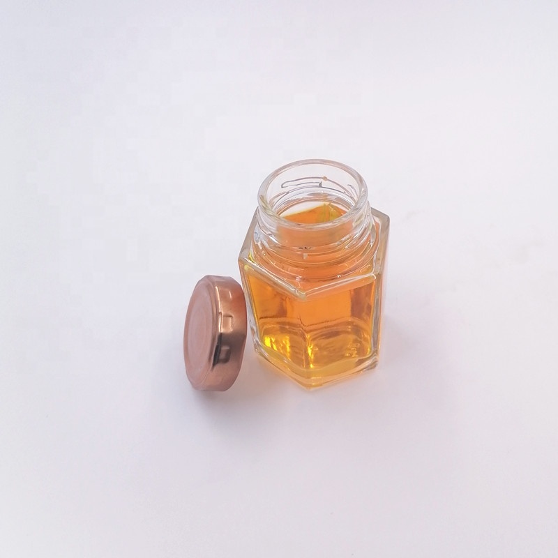 hot sale  wide mouth honey bee jar spice food container storage caviar glass bottle hexagon 60ml jam sauce twist off lid vitamin
