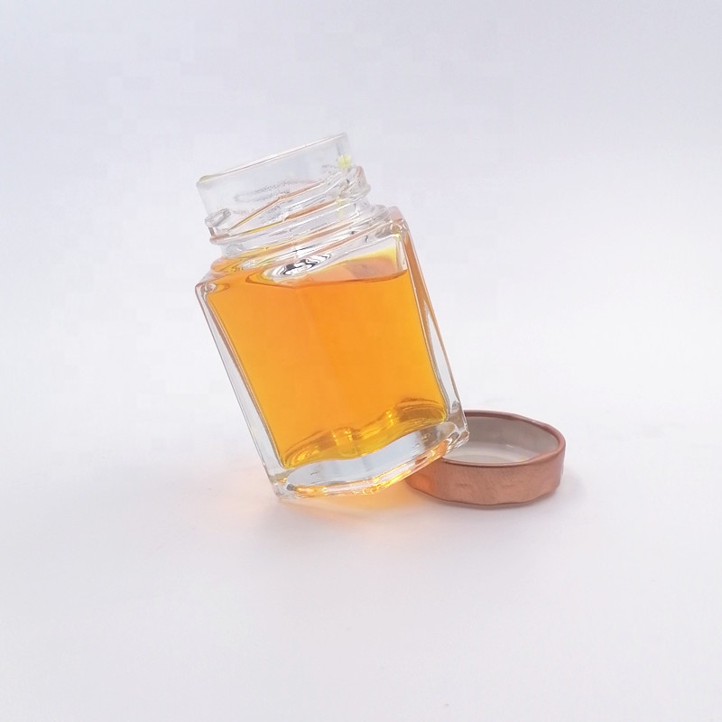 hot sale wide mouth honey bee jar spice food container storage caviar glass bottle hexagon 60ml jam sauce twist off lid vitamin