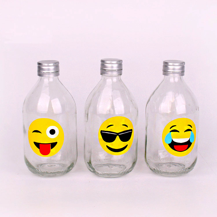 hot selling 330ml clear round glass bottle with screw top lids funny design of juice bottle