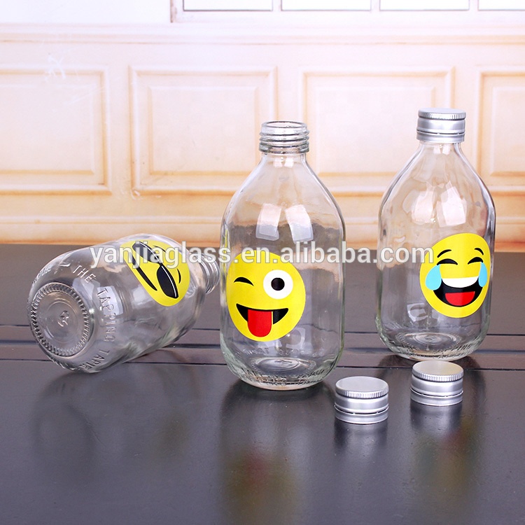 hot selling 330ml clear round glass bottle with screw top lids funny design of juice bottle