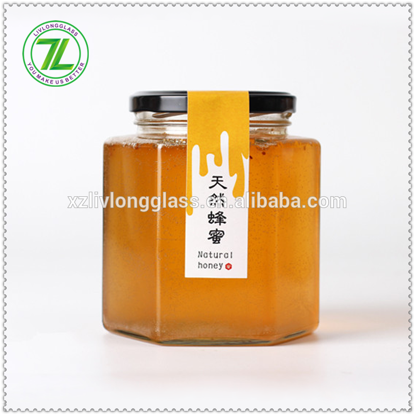 hot selling whole 1000g 730ml 35oz glass bee shaped honey jar glass hexagonal jar for honey package with metal lids