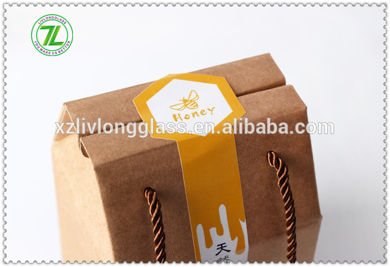 hot selling whole 1000g 730ml 35oz glass bee shaped honey jar glass hexagonal jar for honey package with metal lids